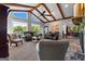 Bright living room with vaulted ceilings, exposed beams, large windows, and beautiful lake views at 8655 Shoreline Dr, Jonesboro, GA 30236