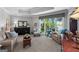 Inviting living room features large windows with lake views, comfortable seating, and neutral decor at 8655 Shoreline Dr, Jonesboro, GA 30236