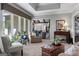 Spacious living room showcasing a large window, comfortable seating and open layout to other living spaces at 8655 Shoreline Dr, Jonesboro, GA 30236