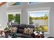 Cozy living room showcasing lake views, large windows, and comfortable seating at 8655 Shoreline Dr, Jonesboro, GA 30236