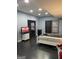 Bedroom features dark vinyl flooring, neutral paint, and recessed lights at 2467 Highway 138 Sw, Conyers, GA 30094