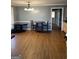 Dining room featuring hardwood floors, a window, and traditional chandelier at 2467 Highway 138 Sw, Conyers, GA 30094
