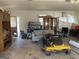 Garage interior with various items including a mower and cabinets at 2467 Highway 138 Sw, Conyers, GA 30094