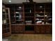 Living room with built-in wooden cabinets and shelves perfect for organization at 2467 Highway 138 Sw, Conyers, GA 30094