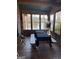 Enclosed porch featuring a picnic table with views of the lake at 2467 Highway 138 Sw, Conyers, GA 30094