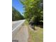 Street with mailboxes, road, and green foliage on a clear day at 2467 Highway 138 Sw, Conyers, GA 30094