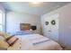 Sun-filled bedroom featuring carpeted floor, window, white furniture, and minimalist decor at 101 Greenfield Ln, Grantville, GA 30220