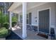 Inviting front porch featuring stone accents, a chair, and a view of the front yard at 101 Greenfield Ln, Grantville, GA 30220