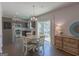 Eat-in kitchen features stainless appliances, granite counters, hardwood floors and slider to patio at 101 Greenfield Ln, Grantville, GA 30220