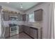 Kitchen with stainless appliances, granite countertops, and plenty of cabinet storage space at 101 Greenfield Ln, Grantville, GA 30220