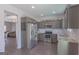 Kitchen with stainless appliances, granite counters, and gray cabinets at 101 Greenfield Ln, Grantville, GA 30220