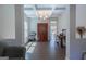 Bright living room featuring coffered ceilings, hardwood floors, and natural light from a large window at 101 Greenfield Ln, Grantville, GA 30220