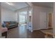 Open concept living area with dark wood floors, neutral paint, and comfortable seating at 101 Greenfield Ln, Grantville, GA 30220