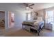 Spacious main bedroom with natural light, neutral paint, and a view into the walk-in closet at 101 Greenfield Ln, Grantville, GA 30220