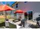 Outdoor patio area complete with seating, an outdoor kitchen, and two large umbrellas at 101 Greenfield Ln, Grantville, GA 30220