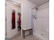 Shower and walk-in closet featuring tile flooring and convenient built-in bench seating at 101 Greenfield Ln, Grantville, GA 30220