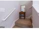 Upstairs landing showcasing decor table, mirror, carpet stairs and banister at 101 Greenfield Ln, Grantville, GA 30220