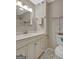 Charming bathroom featuring a patterned tile floor and vanity with storage at 106 Gateway Pt, Peachtree City, GA 30269