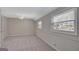 Bedroom featuring neutral walls and carpet, and two windows for natural light at 106 Gateway Pt, Peachtree City, GA 30269