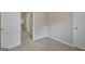 Bedroom featuring neutral walls and carpet with an open door to the rest of the home at 106 Gateway Pt, Peachtree City, GA 30269