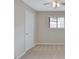 Bedroom featuring neutral walls and carpet, with a single window and ceiling fan at 106 Gateway Pt, Peachtree City, GA 30269