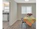 The dining area features a window and a colorful table setup, next to an updated kitchen at 106 Gateway Pt, Peachtree City, GA 30269