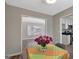 Bright dining area with open floor plan features neutral colors and flower centerpiece at 106 Gateway Pt, Peachtree City, GA 30269