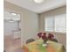 Bright dining area with views to the kitchen, featuring a table with flower centerpiece at 106 Gateway Pt, Peachtree City, GA 30269