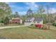 Two story home with brick front, a well-kept lawn, and landscaped flower beds at 106 Gateway Pt, Peachtree City, GA 30269