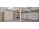 Spacious two-car garage with storage and ample room for vehicles at 106 Gateway Pt, Peachtree City, GA 30269