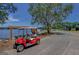 Image featuring a golf cart parked beside a lake and a wooded area at 106 Gateway Pt, Peachtree City, GA 30269