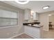 Eat-in kitchen features stainless appliances, granite countertops, and bright lighting at 106 Gateway Pt, Peachtree City, GA 30269