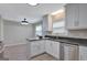 Kitchen features white cabinets, granite countertops, and stainless steel appliances at 106 Gateway Pt, Peachtree City, GA 30269