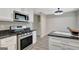 Updated kitchen with stainless steel oven and granite countertops is ready to be used at 106 Gateway Pt, Peachtree City, GA 30269