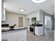 Updated kitchen features granite countertops and stainless steel appliances at 106 Gateway Pt, Peachtree City, GA 30269