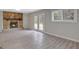 The living room is spacious with an stone fireplace, built-in shelves, and french doors at 106 Gateway Pt, Peachtree City, GA 30269