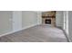 The living room is spacious, and it has an stone fireplace with built-in shelving at 106 Gateway Pt, Peachtree City, GA 30269