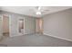 The spacious main bedroom offers neutral walls, carpet, and an ensuite bathroom at 106 Gateway Pt, Peachtree City, GA 30269