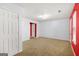 Spacious bedroom with carpet floors, white walls, and a door that leads to the living area at 6887 Slate Stone Se Way # 3, Mableton, GA 30126