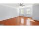 Spacious bedroom with wood flooring, ample natural light from large windows, and neutral paint color at 6887 Slate Stone Se Way # 3, Mableton, GA 30126