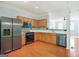Well-lit kitchen featuring stainless steel appliances, ample counter space, and open layout to adjacent rooms at 6887 Slate Stone Se Way # 3, Mableton, GA 30126