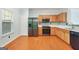 Well-lit kitchen featuring stainless steel appliances, ample counter space, and open layout to adjacent rooms at 6887 Slate Stone Se Way # 3, Mableton, GA 30126