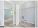 Well-lit laundry room with washer/dryer hookups, wire shelving, with easy access to a bedroom at 6887 Slate Stone Se Way # 3, Mableton, GA 30126
