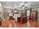 Spacious bedroom with hardwood floors, ceiling fan, and natural light from the windows at 2008 Highway 92 S, Fayetteville, GA 30215