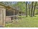 Spacious chicken coop with wire fencing, providing a safe and comfortable outdoor enclosure for poultry at 2008 Highway 92 S, Fayetteville, GA 30215