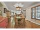 Bright dining room showcases hardwood floors, shutters, and a stylish lighting fixture at 2008 Highway 92 S, Fayetteville, GA 30215