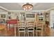 Farmhouse style dining room features a wooden table, rustic chandelier, and decor at 2008 Highway 92 S, Fayetteville, GA 30215