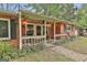 Welcoming front porch of a brick home with traditional decor and manicured landscaping at 2008 Highway 92 S, Fayetteville, GA 30215