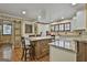 Bright kitchen with island, granite countertops, and stainless steel appliances at 2008 Highway 92 S, Fayetteville, GA 30215
