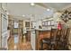 Open kitchen with wood island, granite countertops, and modern appliances at 2008 Highway 92 S, Fayetteville, GA 30215